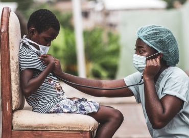 african-american-boy-getting-checkup-by-doctor_181624-35925