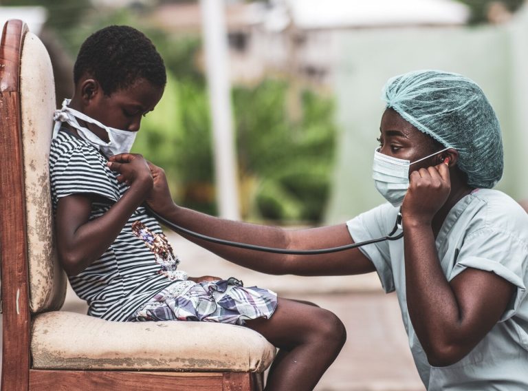 african-american-boy-getting-checkup-by-doctor_181624-35925